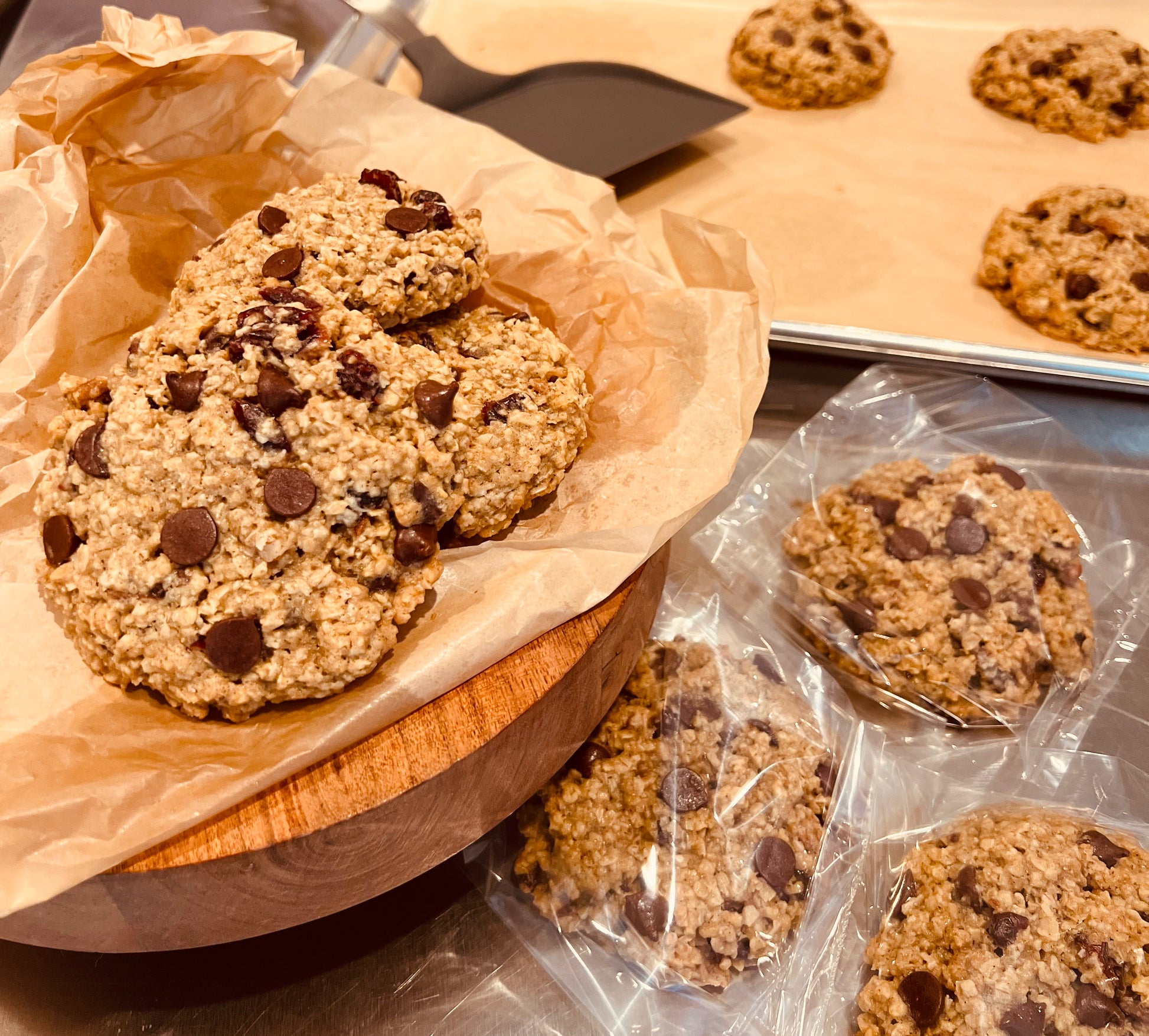 Oatmeal cranberry dark chocolate with pecan cookies individually wrapped.  Also displayed on trivet and cookie sheet.